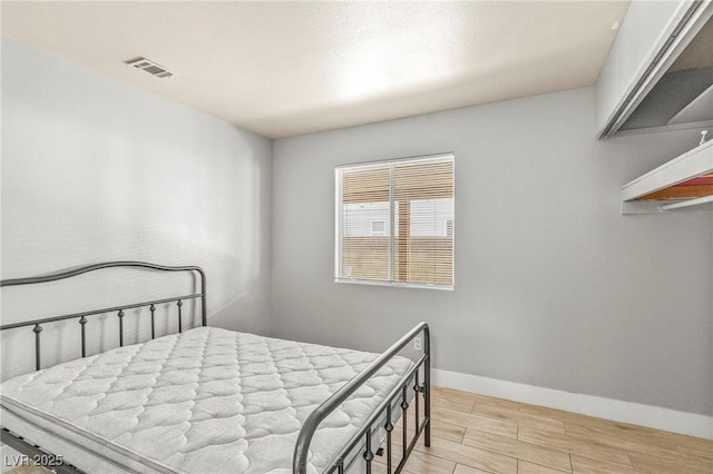 5616 Royal Castle Ln, Las Vegas, NV 89130 - bedroom featuring wood tiled floors and baseboards