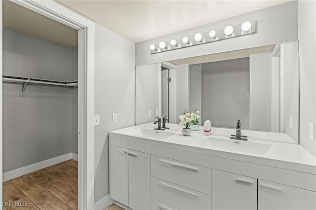 5616 Royal Castle Ln, Las Vegas, NV 89130 - full bath featuring double vanity, wood finished floors, and a spacious closet