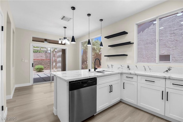 2118 High Mesa Dr, Henderson, NV 89012 - kitchen featuring stainless steel dishwasher, light wood-style floors, white cabinets, a peninsula, and light stone counters
