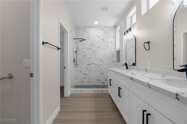 2118 High Mesa Dr, Henderson, NV 89012 - full bath with a marble finish shower, double vanity, recessed lighting, and wood finished floors