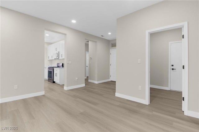 2118 High Mesa Dr, Henderson, NV 89012 - unfurnished living room with light wood finished floors and recessed lighting