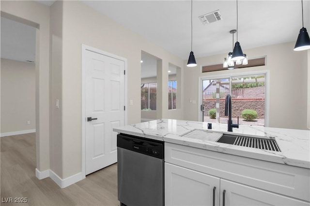 2118 High Mesa Dr, Henderson, NV 89012 - kitchen with stainless steel dishwasher, light wood-type flooring, light stone counters, and white cabinetry