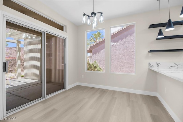 2118 High Mesa Dr, Henderson, NV 89012 - unfurnished dining area featuring a chandelier and wood finished floors