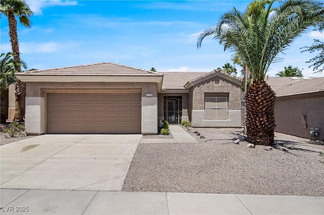 2118 High Mesa Dr, Henderson, NV 89012 - view of front of home with stucco siding, a tile roof, a garage, and driveway