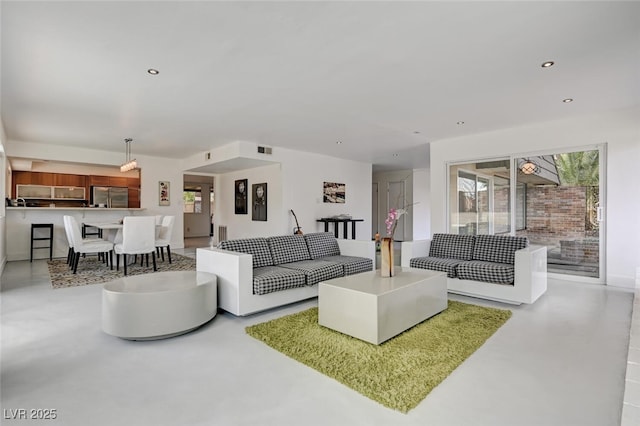2095 Mohigan Way, Las Vegas, NV 89169 - living area with concrete floors and recessed lighting