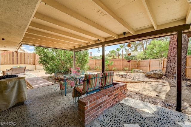 2095 Mohigan Way, Las Vegas, NV 89169 - fenced backyard with a patio and an outdoor hangout area