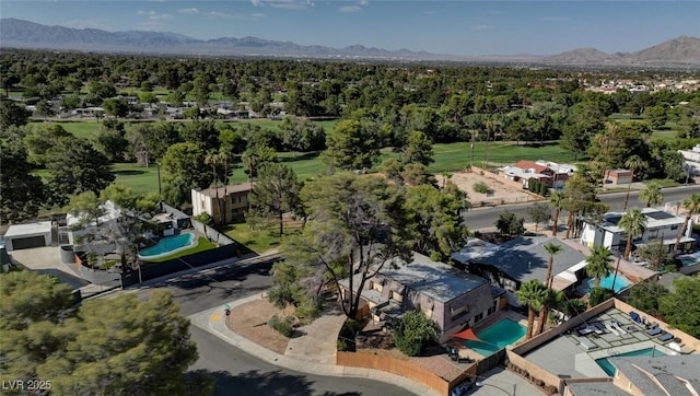 2095 Mohigan Way, Las Vegas, NV 89169 - aerial perspective of suburban area with a pool area and mountains