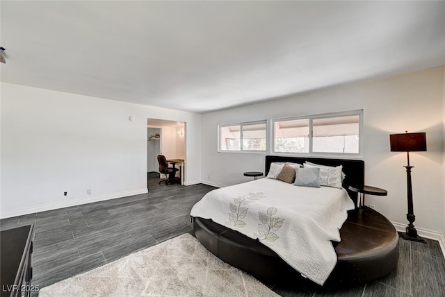 2095 Mohigan Way, Las Vegas, NV 89169 - bedroom with baseboards and dark wood-style floors