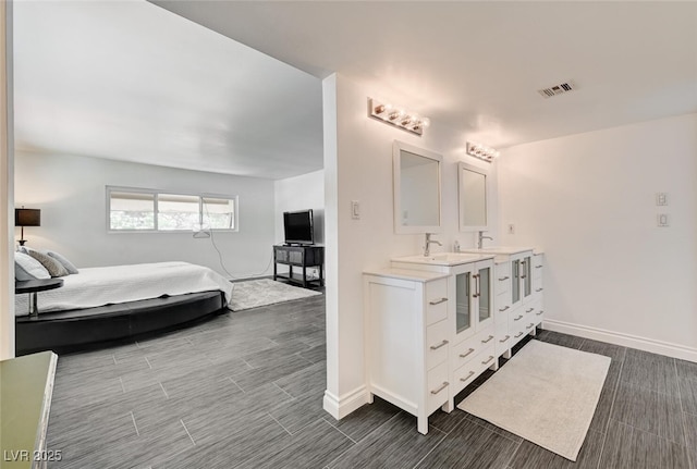 2095 Mohigan Way, Las Vegas, NV 89169 - bathroom with double vanity and wood finish floors