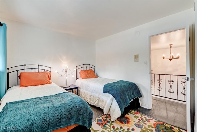 2095 Mohigan Way, Las Vegas, NV 89169 - bedroom with a chandelier and wood finished floors
