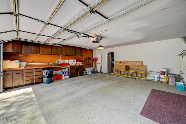 2095 Mohigan Way, Las Vegas, NV 89169 - garage featuring a garage door opener and water heater