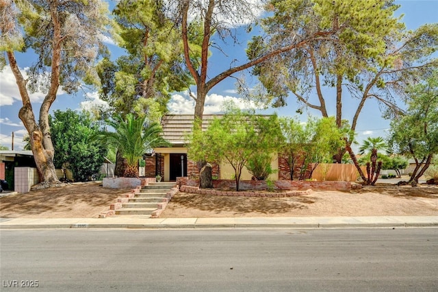 2095 Mohigan Way, Las Vegas, NV 89169 - view of front of home featuring mansard roof