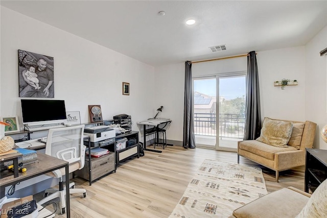 7024 Geese Gathering St, North Las Vegas, NV 89084 - home office featuring light wood-style flooring and recessed lighting