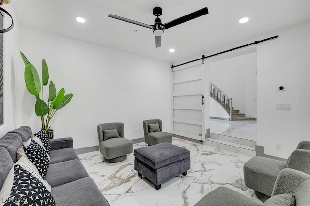 7024 Geese Gathering St, North Las Vegas, NV 89084 - living room featuring a barn door, marble tiled floors, recessed lighting, a ceiling fan, and stairs