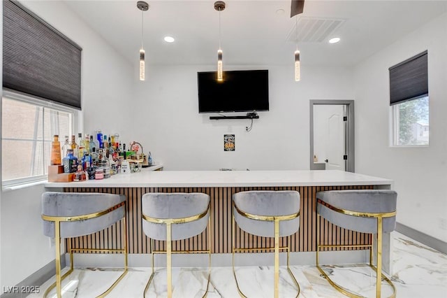 7024 Geese Gathering St, North Las Vegas, NV 89084 - indoor dry bar featuring healthy amount of natural light, decorative light fixtures, and recessed lighting