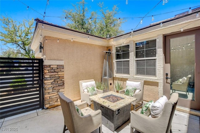 7024 Geese Gathering St, North Las Vegas, NV 89084 - view of patio featuring a fire pit and a gate