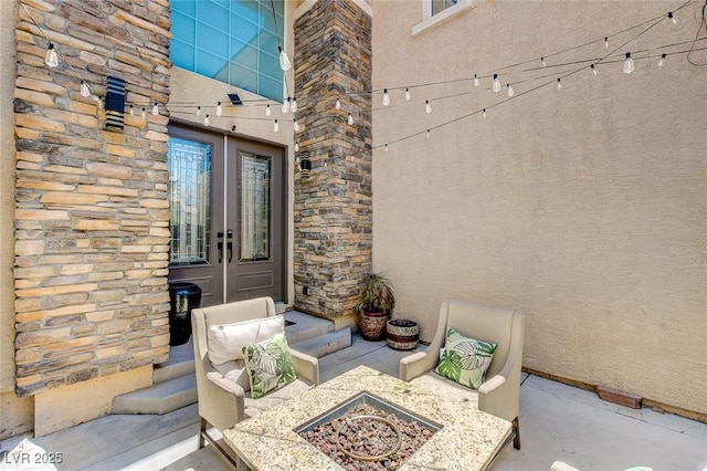 7024 Geese Gathering St, North Las Vegas, NV 89084 - view of exterior entry featuring french doors, stone siding, and stucco siding