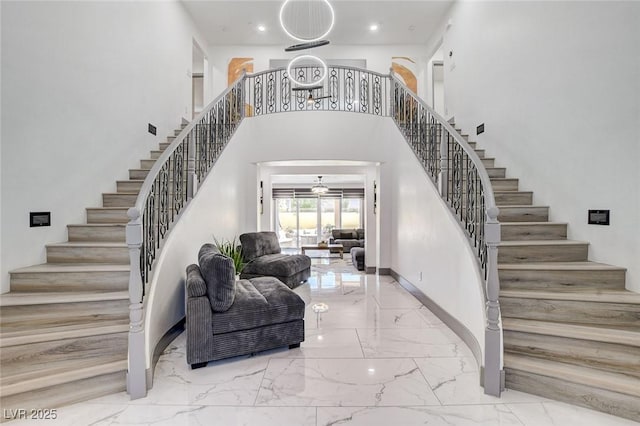 7024 Geese Gathering St, North Las Vegas, NV 89084 - stairway with marble tiled floors, a towering ceiling, and recessed lighting
