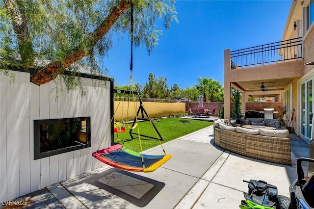 7024 Geese Gathering St, North Las Vegas, NV 89084 - patio / terrace featuring a patio area, a fenced backyard, outdoor lounge area, and a ceiling fan