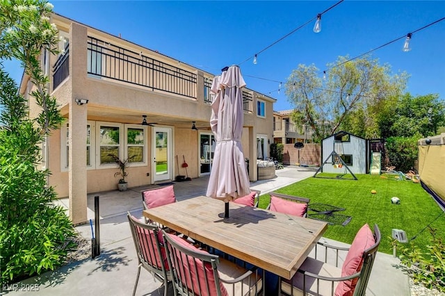 7024 Geese Gathering St, North Las Vegas, NV 89084 - patio / terrace with a patio, ceiling fan, a storage unit, and outdoor dining space