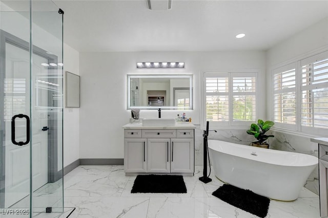 7024 Geese Gathering St, North Las Vegas, NV 89084 - bathroom with vanity, a shower stall, a freestanding bath, healthy amount of natural light, and recessed lighting