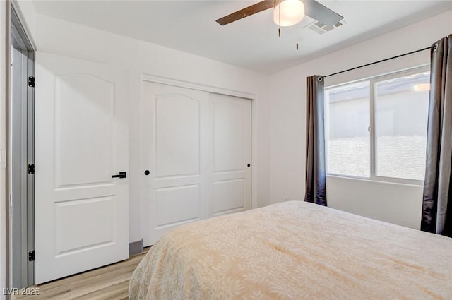 7024 Geese Gathering St, North Las Vegas, NV 89084 - bedroom with a closet, light wood-style flooring, and ceiling fan