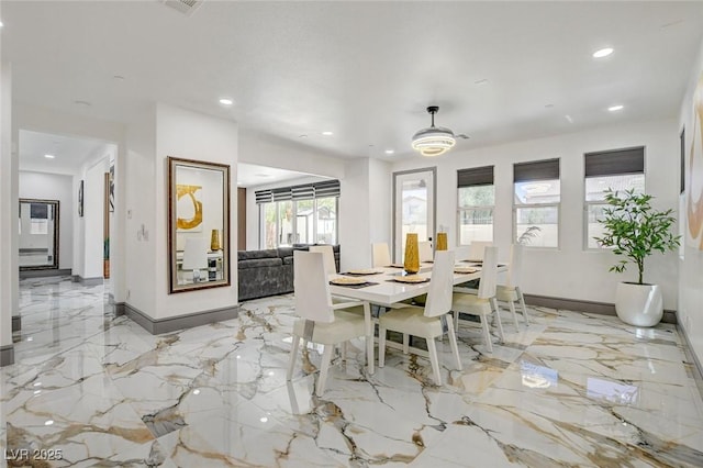 7024 Geese Gathering St, North Las Vegas, NV 89084 - dining area featuring light marble finish floors and recessed lighting