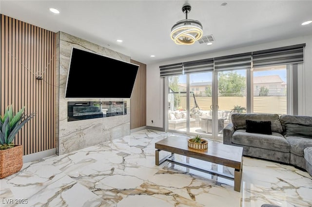 7024 Geese Gathering St, North Las Vegas, NV 89084 - living area with recessed lighting and light marble finish flooring
