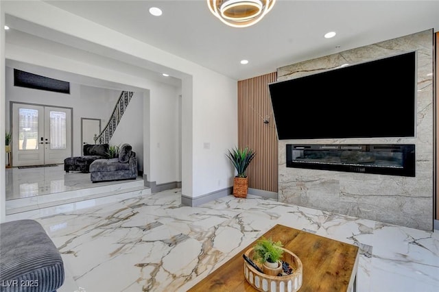 7024 Geese Gathering St, North Las Vegas, NV 89084 - living area featuring recessed lighting, french doors, marble tiled flooring, and an accent wall