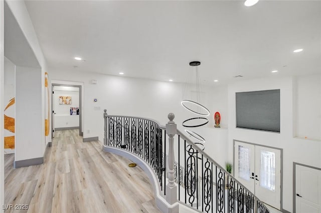 7024 Geese Gathering St, North Las Vegas, NV 89084 - hall featuring an upstairs landing, light wood-style flooring, recessed lighting, and french doors
