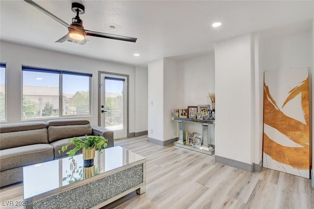 7024 Geese Gathering St, North Las Vegas, NV 89084 - living area featuring a ceiling fan, wood finished floors, and recessed lighting