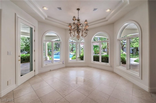 8021 Obannon Dr, Las Vegas, NV 89117 - unfurnished dining area with a tray ceiling, light tile patterned floors, a chandelier, and recessed lighting