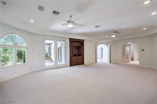 8021 Obannon Dr, Las Vegas, NV 89117 - empty room featuring ceiling fan, arched walkways, light carpet, and recessed lighting