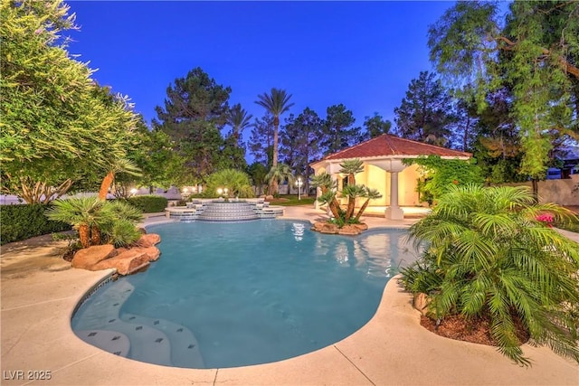 8021 Obannon Dr, Las Vegas, NV 89117 - pool at night featuring an outdoor pool