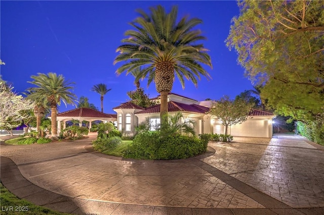 8021 Obannon Dr, Las Vegas, NV 89117 - mediterranean / spanish house with stucco siding, driveway, and a tiled roof