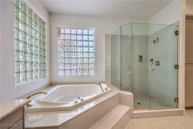 8021 Obannon Dr, Las Vegas, NV 89117 - full bathroom featuring a garden tub, a shower stall, and vanity