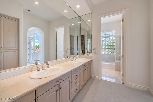 8021 Obannon Dr, Las Vegas, NV 89117 - full bath with healthy amount of natural light, double vanity, recessed lighting, and a bath