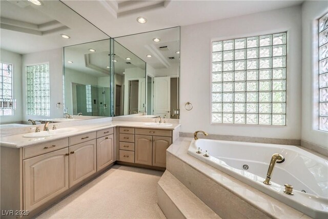 8021 Obannon Dr, Las Vegas, NV 89117 - bathroom with double vanity, a jetted tub, recessed lighting, and a stall shower