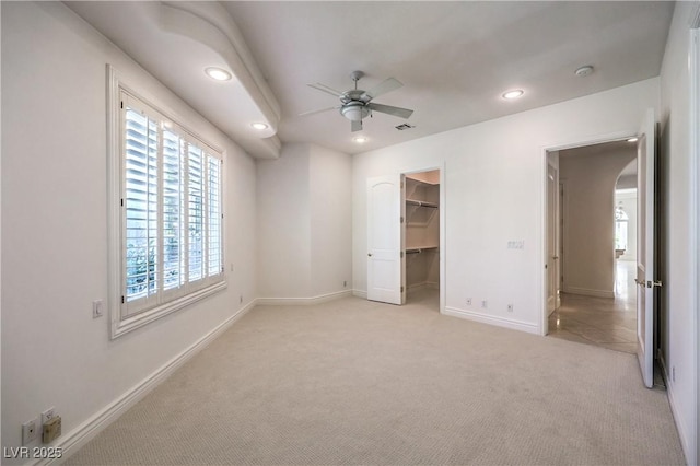 8021 Obannon Dr, Las Vegas, NV 89117 - unfurnished bedroom featuring light carpet, multiple windows, recessed lighting, and a spacious closet