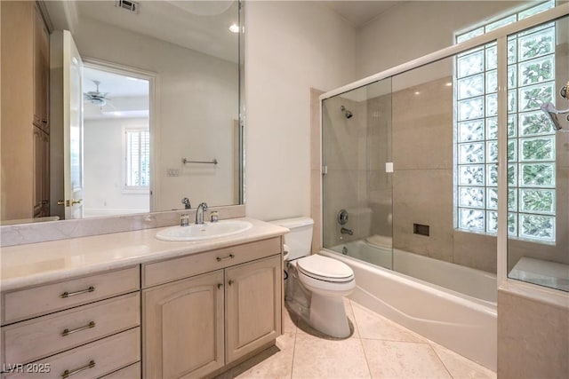 8021 Obannon Dr, Las Vegas, NV 89117 - bathroom featuring vanity, enclosed tub / shower combo, tile patterned floors, and a ceiling fan