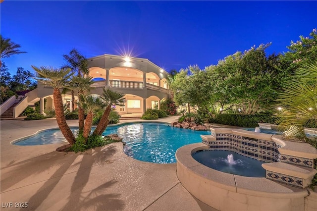 8021 Obannon Dr, Las Vegas, NV 89117 - pool at twilight featuring a pool with connected hot tub and a patio