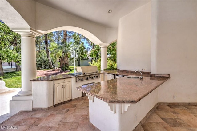 8021 Obannon Dr, Las Vegas, NV 89117 - view of patio / terrace featuring an outdoor kitchen and a sink