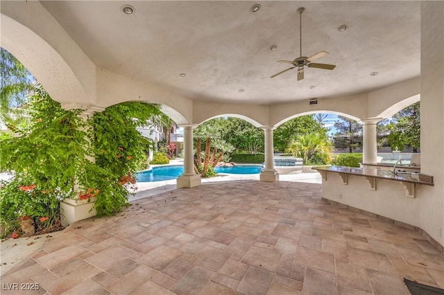8021 Obannon Dr, Las Vegas, NV 89117 - view of patio / terrace with an outdoor pool, ceiling fan, and an in-ground hot tub