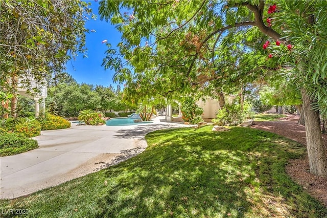8021 Obannon Dr, Las Vegas, NV 89117 - view of grassy yard featuring a patio area