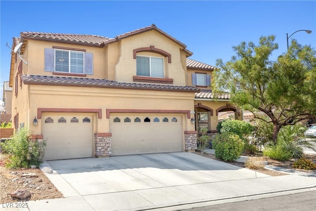 1141 Brent Park Ct, Henderson, NV 89002 - mediterranean / spanish house featuring a garage, driveway, and stucco siding