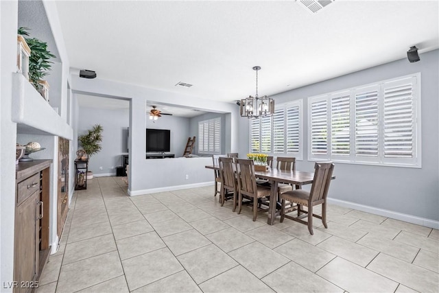 1141 Brent Park Ct, Henderson, NV 89002 - dining room featuring light tile patterned flooring, ceiling fan, and a chandelier