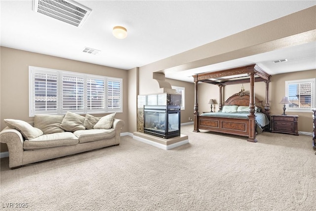 1141 Brent Park Ct, Henderson, NV 89002 - carpeted bedroom with baseboards and a multi sided fireplace