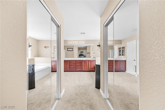 1141 Brent Park Ct, Henderson, NV 89002 - hallway with light colored carpet and a textured wall