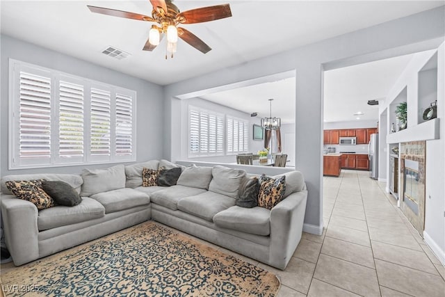 1141 Brent Park Ct, Henderson, NV 89002 - living area with light tile patterned flooring, ceiling fan, and a chandelier