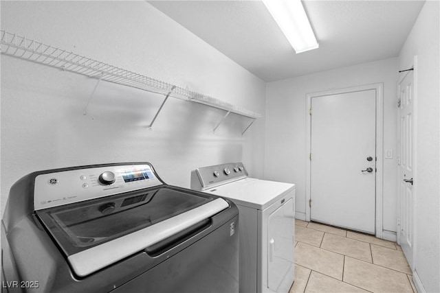 1141 Brent Park Ct, Henderson, NV 89002 - laundry room with washing machine and dryer and light tile patterned floors